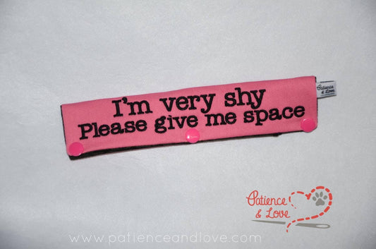 One Leash Sleeve embroidered with the following on both sides of the sleeve:       I'm very shy, Please Give Me Space,      Example in the listing photo has the following color selections:        • Pink fabric, Black text.
