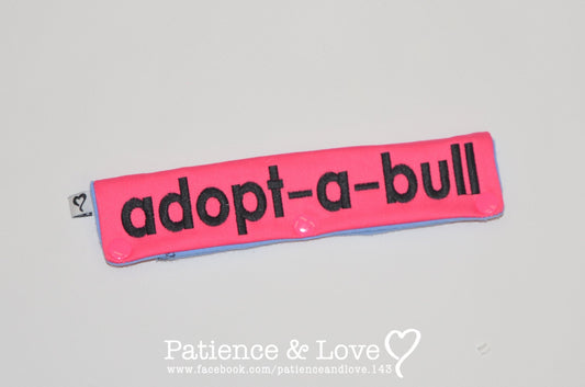 One Leash Sleeve embroidered with the following on both sides of the sleeve:       adopt-a-bull      Example in the listing photo has the following color selections:        • Pink fabric, Black (1800) text.