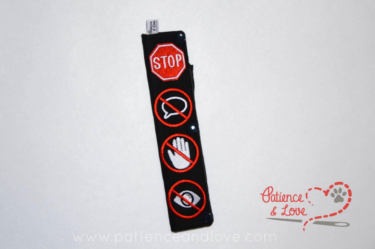 One Leash Sleeve embroidered with the following on both sides of the sleeve:       Symbols, vertical layout, stop sign, no touch, no talk, no eye contact,      Example in the listing photo has the following color selections:        • Black fabric, red (1637) crossouts, white symbols.