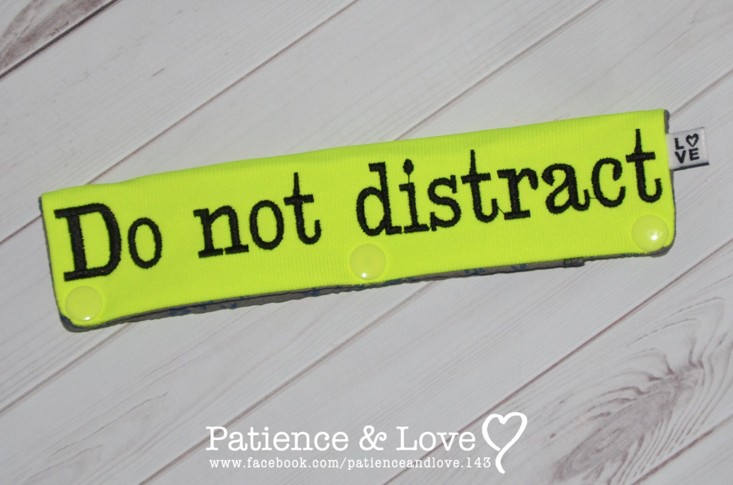 Bright yellow sleeve with black text that says do not distract
