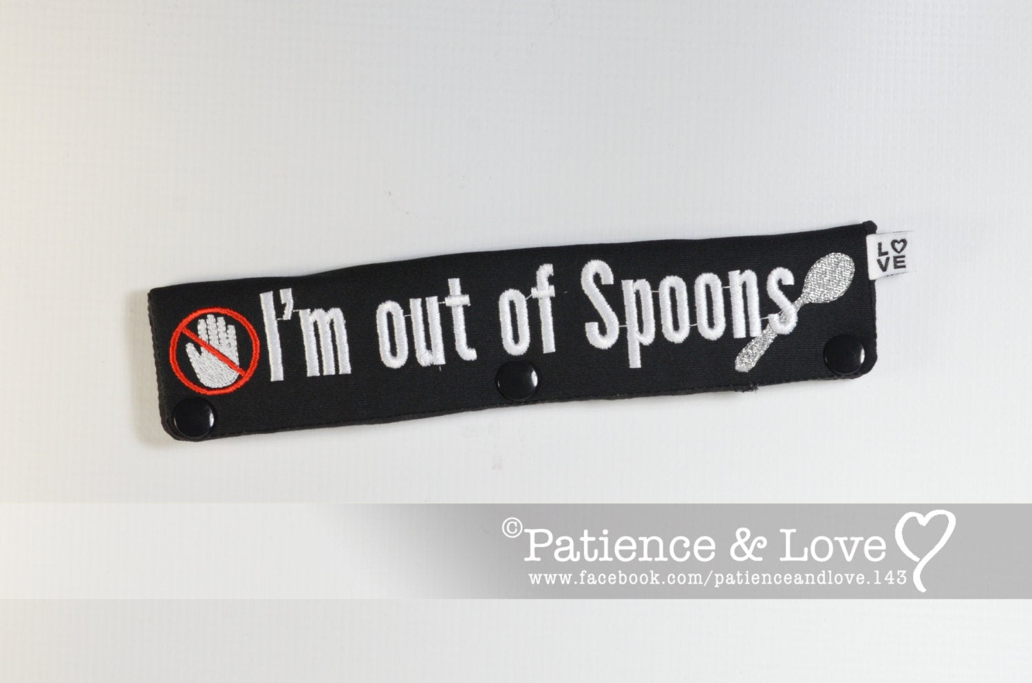 One Leash Sleeve embroidered with the following on both sides of the sleeve       "I'm out of spoons" with crossed out hand and a spoon   As seen in the listing photo.   Listing photo shows black fabric with white text and red cross out and a sliver spoon.