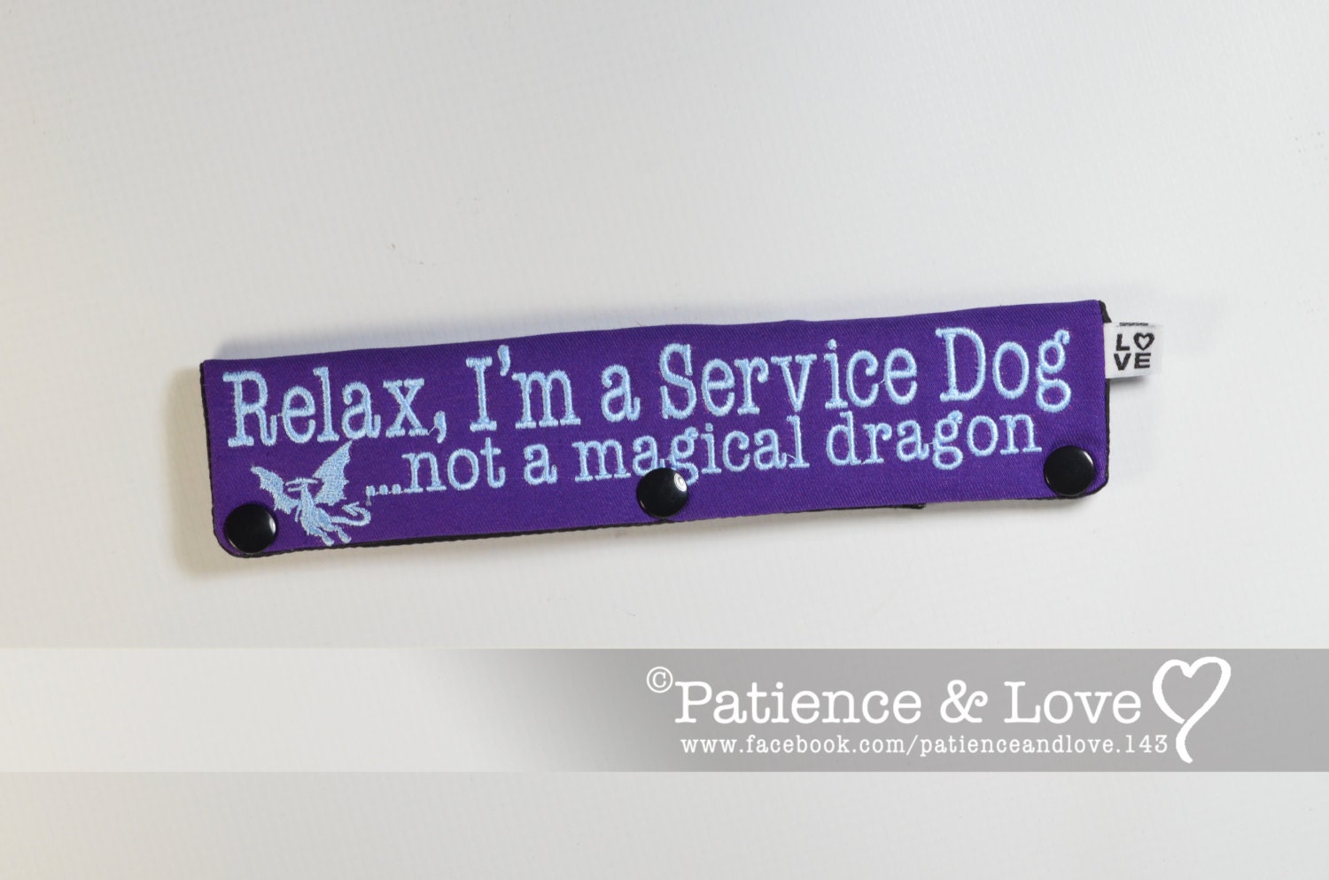 Purple leash sleeve that says relax, i'm a service dog...not a magical dragon with a little dragon included.