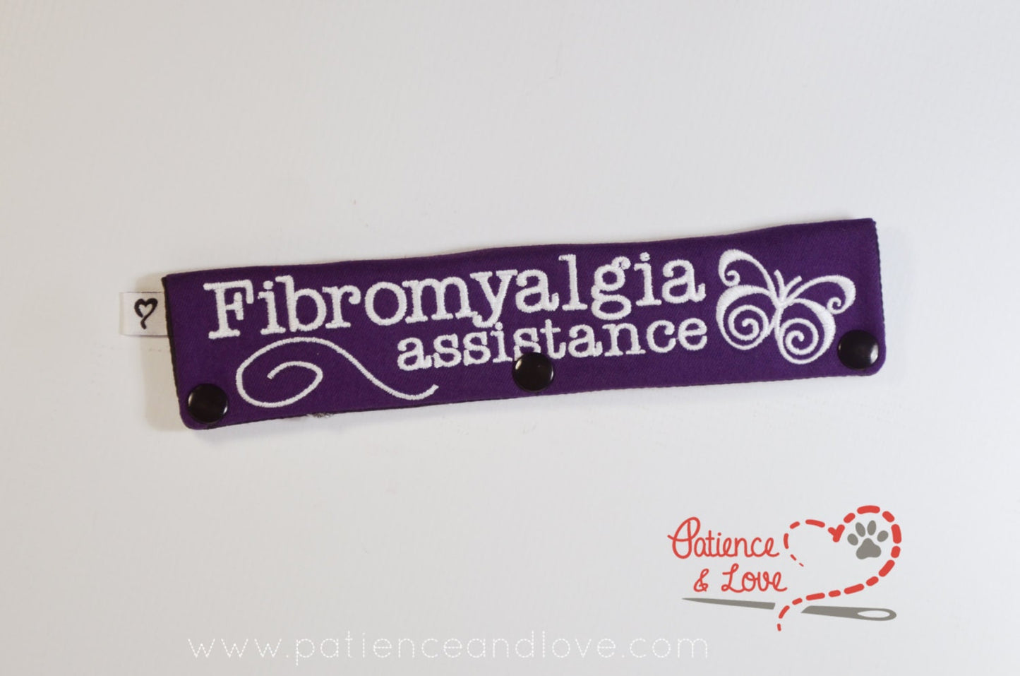 One Leash Sleeve embroidered with the following on both sides of the sleeve:        Fibromyalgia Assistance with a pretty butterfly and swirl     Example in the listing photo has the following color selections:        • Purple fabric, White text.