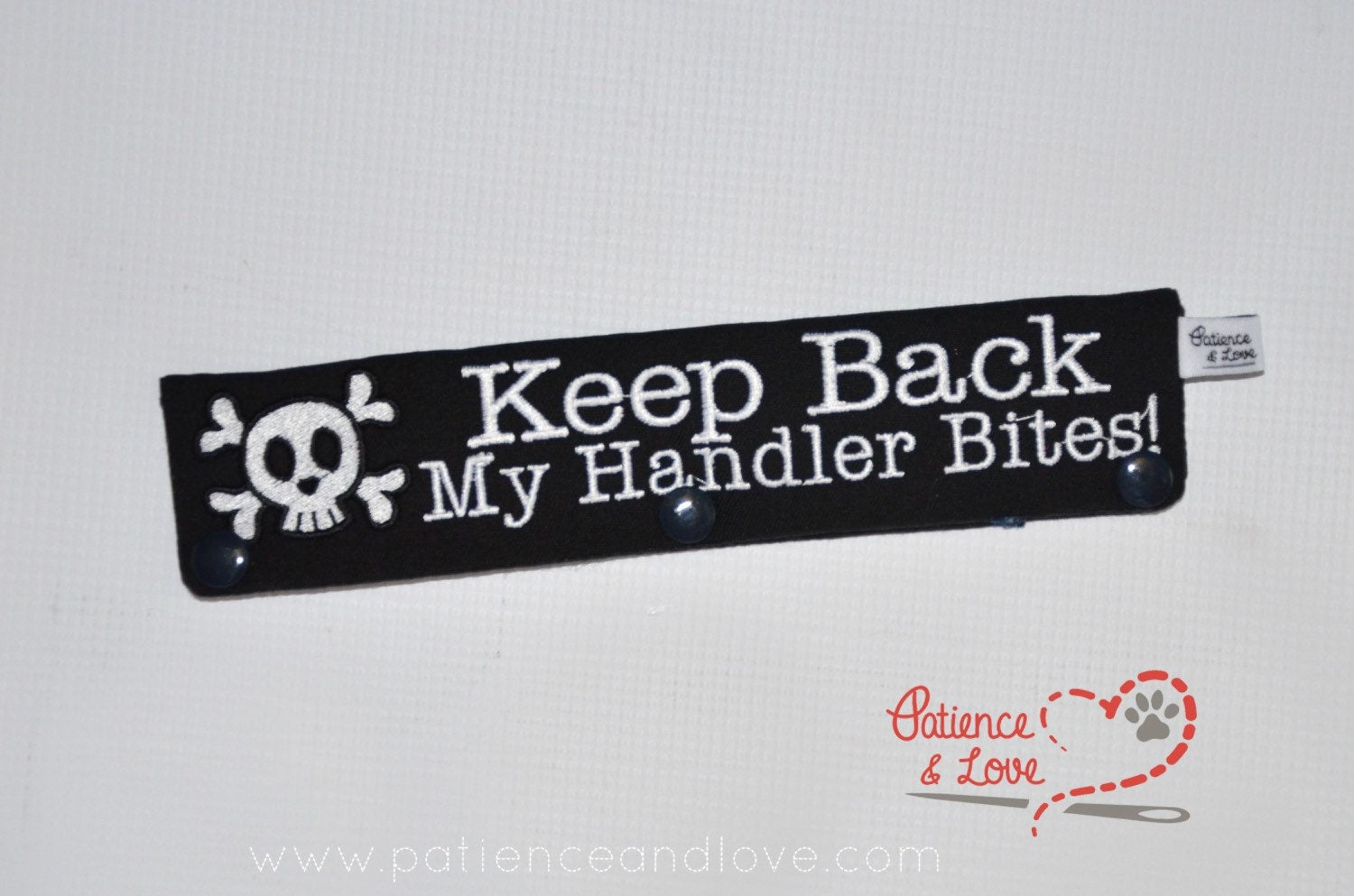One Leash Sleeve embroidered with the following on both sides of the sleeve:       Keep Back My Handler Bites, skull with cross bones      Example in the listing photo has the following color selections:        • black fabric, white (1805) text.