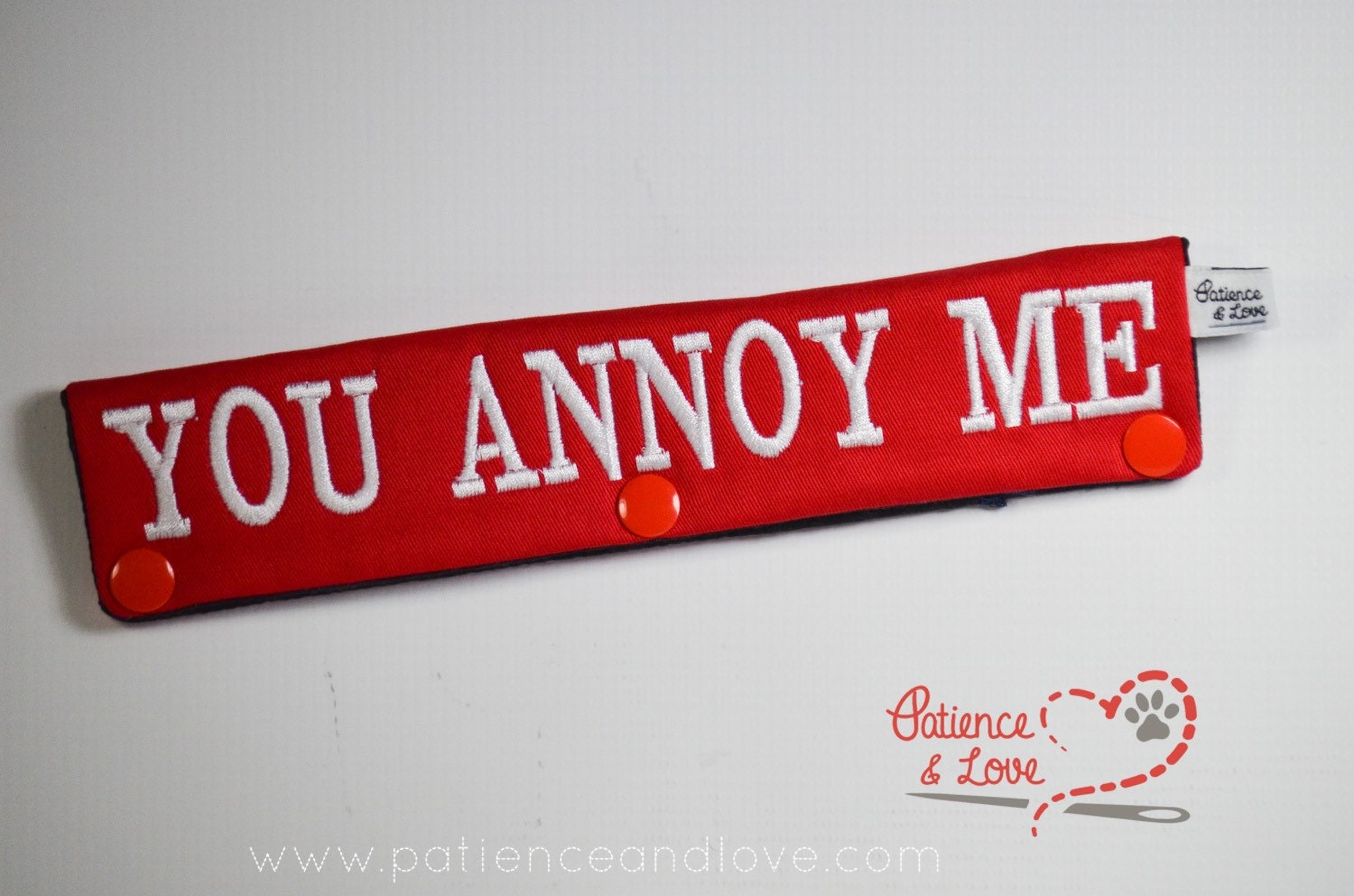 One Leash Sleeve embroidered with the following on both sides of the sleeve:       Go Away - You Annoy Me      Example in the listing photo has the following color selections:        • Red fabric, White (1805) text.