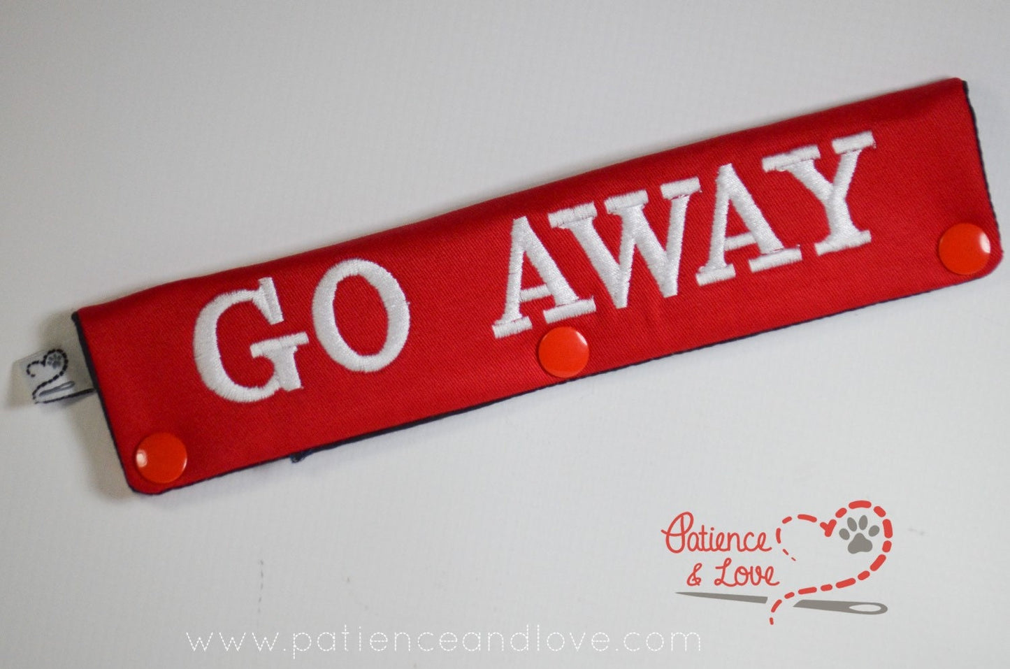 One Leash Sleeve embroidered with the following on both sides of the sleeve:       Go Away - You Annoy Me      Example in the listing photo has the following color selections:        • Red fabric, White (1805) text.