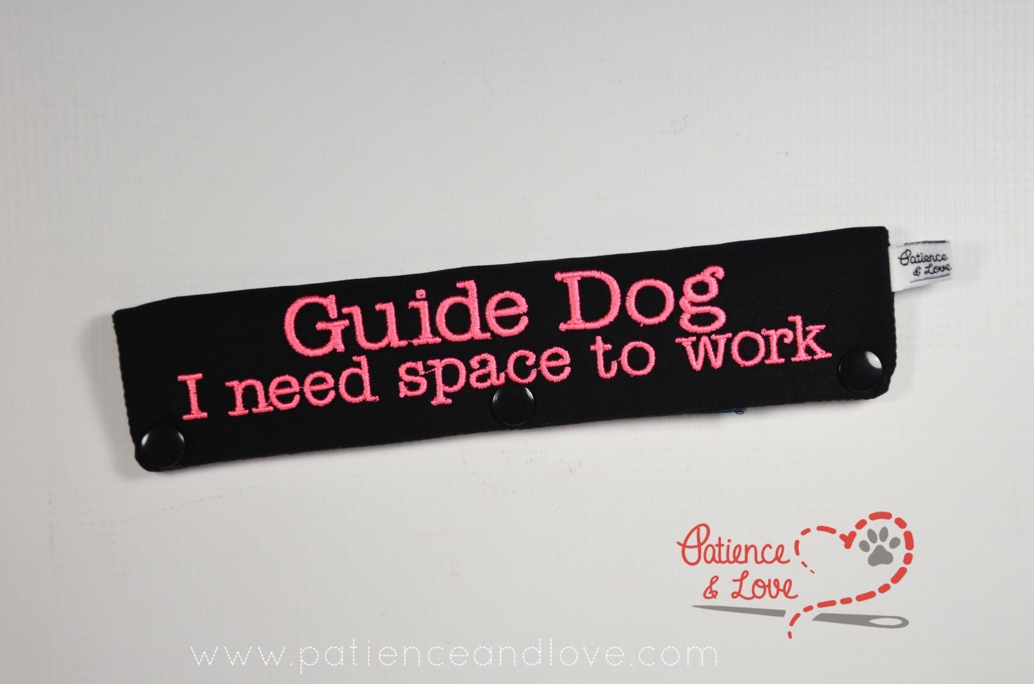 One Leash Sleeve embroidered with the following on both sides of the sleeve:        Guide Dog       I need space to work      Example in the listing photo has the following color selections:        • black fabric, pink (1909) text.