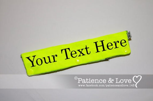 Picture is of the bright yellow fabric with black text that says your text here.