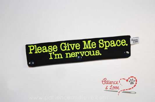  One Leash Sleeve embroidered with the following on both sides of the sleeve:       Please Give Me Space, I'm Nervous      Example in the listing photo has the following color selections:        • Black fabric, bright yellow (1823) text