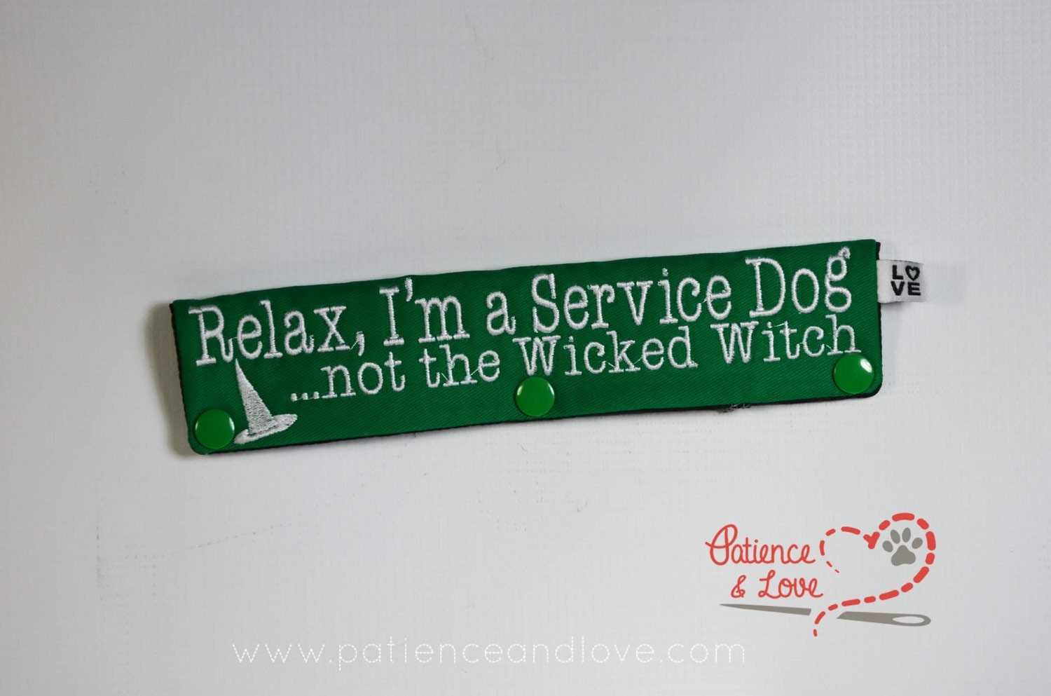 • One Leash Sleeve embroidered with Relax, I'm a Service Dog, Not the wicked witch on both sides. As seen in the listing photo.   Example listing photo shows green fabric with white text.